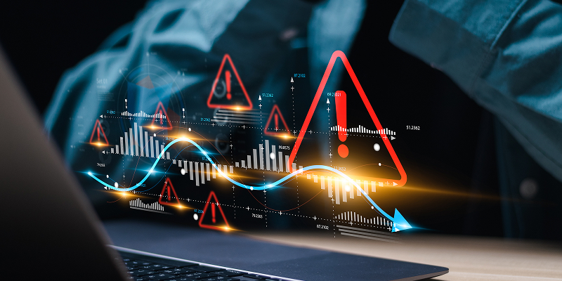 A print operator manually adjusts color settings on a press console, surrounded by color swatches and paper samples—illustrating the limitations of manual color control in print and packaging workflows.