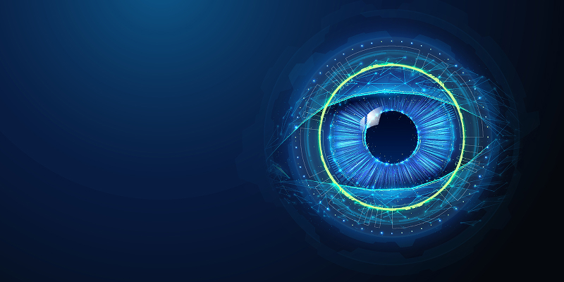 A print operator manually adjusts color settings on a press console, surrounded by color swatches and paper samples—illustrating the limitations of manual color control in print and packaging workflows.