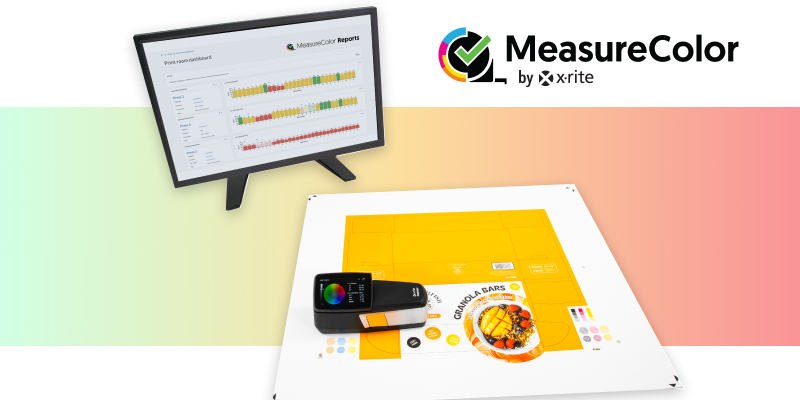 An eXact 2 and MeasureColor color measurement tools sitting on printed material for color assessment.